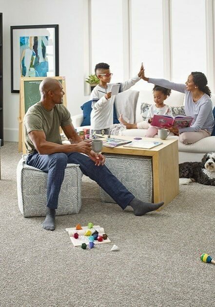 Family enjoying in living room | Floor to Ceiling Freeport